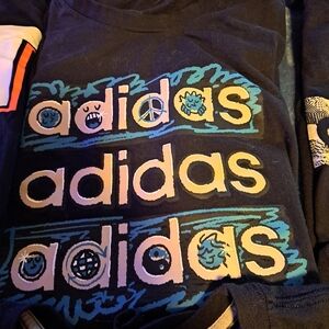 Adidas Black Tee with Vibrant Blue Accents